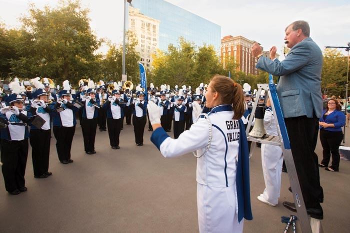 President Thomas J. Haas directs the Laker marching band